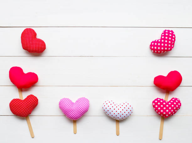 istock Valentine's hearts on white wooden background. 1130234104