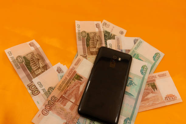 istock Cellphone on the Russian Currency Background bank 1130234167