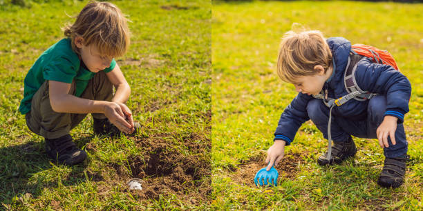 istock The boy plays recycling. He buries plastic disposable dishes and biodegradable dishes. After a few months, he dug up the dishes and saw that the biodegradable dishes began to decompose and plastic did not BANNER, LONG FORMAT 1130236298