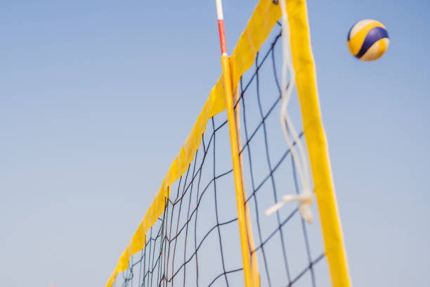 istock Bright beach scene with a net and volley ball at sunset 1130237865