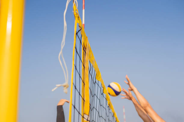istock Bright beach scene with a net and volley ball at sunset 1130237867