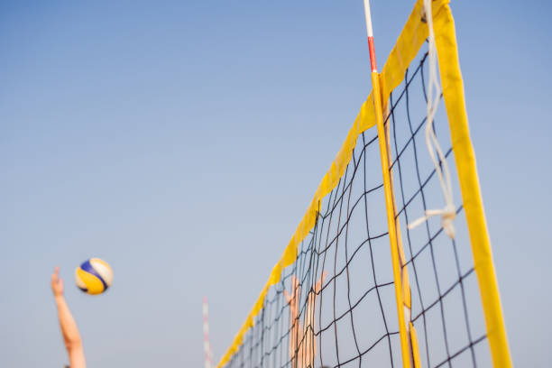 istock Bright beach scene with a net and volley ball at sunset 1130237876