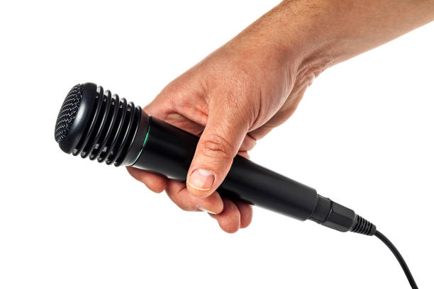istock Hand holding a microphone interview conducting a business isolated on white background. 1130237992