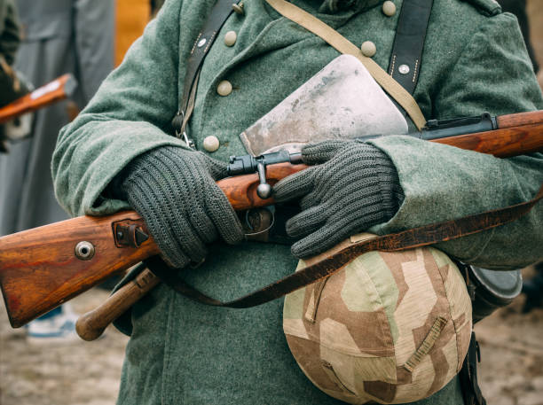 istock Soldier in winter uniform with a rifle in his hands 1130240654