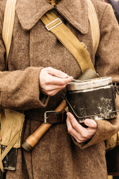 istock Soviet soldiers in greatcoats dinner 1130240673