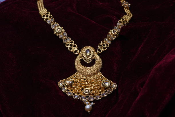 istock golden neck set with pendent closeup macro image 1130240784