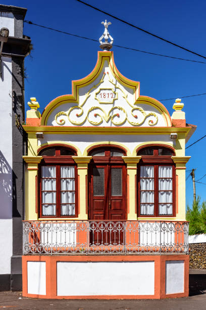 istock ancient yellow house in terceira 1130242103
