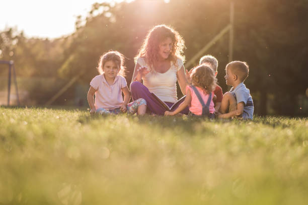 istock Group of happy children having fun in nature 1130243405