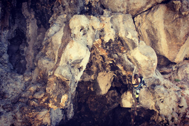 istock Girl rock climber climbs difficult route on the cliffs. 1130243406