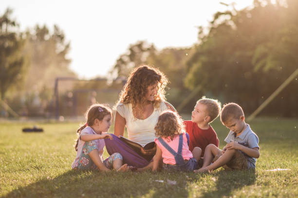 istock Group of happy children having fun in nature 1130243480