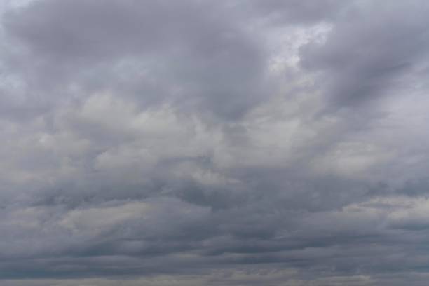 istock Dark clouds overcast the sky before the rain. Dramatic pre-storm view of the sky. 1130244412