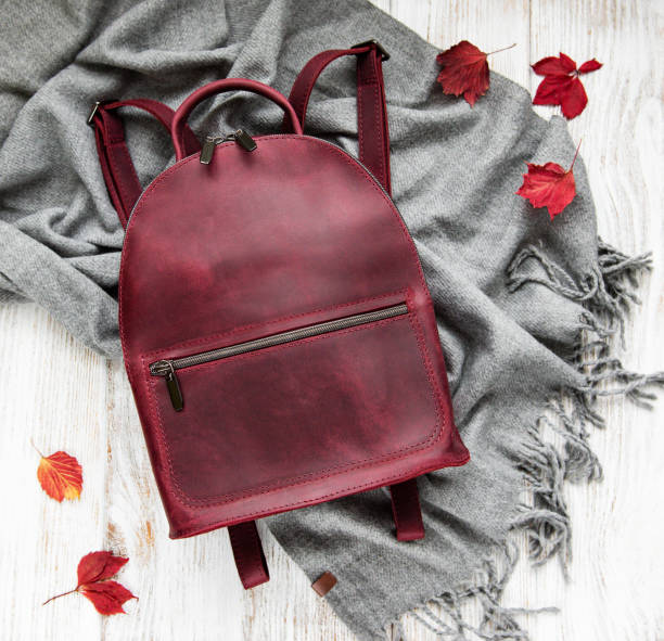 istock woman backpack with grey scarf 1130245526
