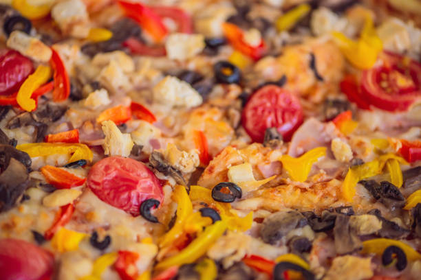 istock Appetizing background pepperoni pizza closeup filling the frame 1130245669