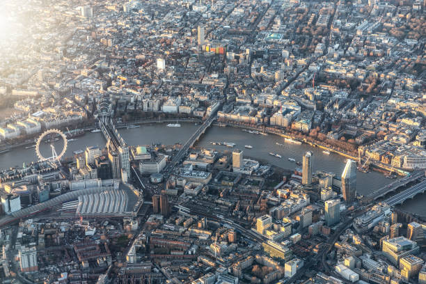 Aerial view of central London, UK, with all the major tourist attractions along the river Thames during sunset time