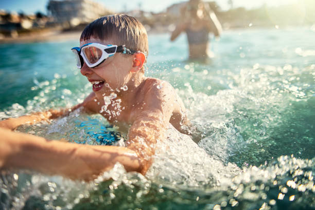 istock Children having fun in sea 1130246758