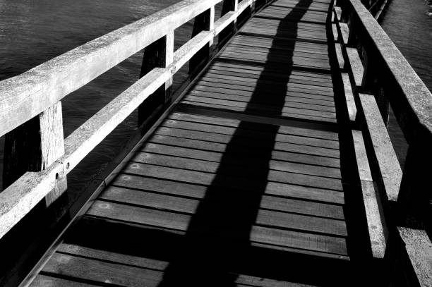 istock Wooden foot bridge with handrails 1130248114