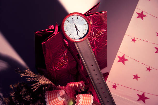 Christmas gifts and wood watch on christmas scenery