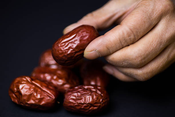 Holding a date - a kind of fruit