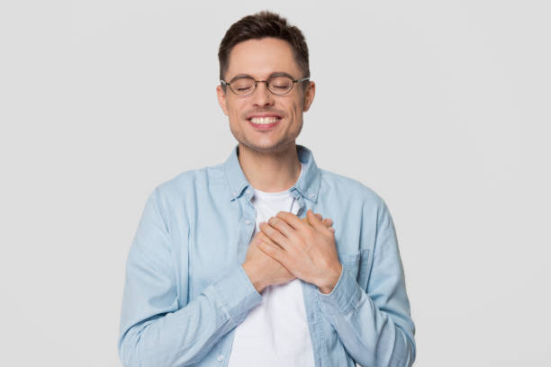 istock Grateful happy man holding hands on chest feeling appreciation 1130250040