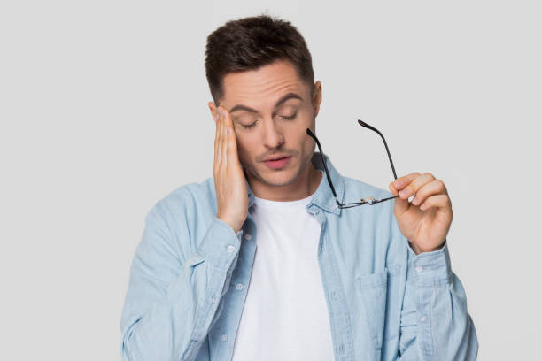 istock Upset young man feeling eyestrain or headache taking off glasses 1130250049