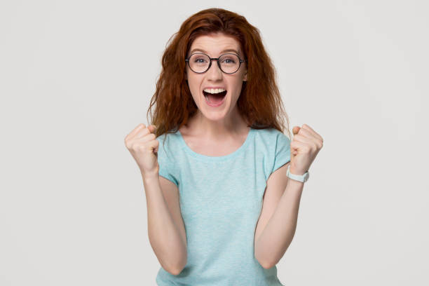 istock Excited overjoyed young redhead woman feel happy looking at camera 1130250119