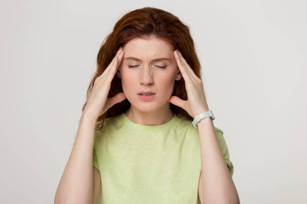 istock Stressed redhead woman feel strong headache isolated on blank background 1130250125