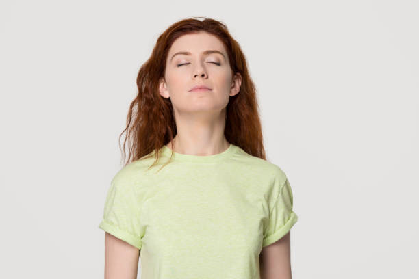 istock Calm mindful redhead woman taking deep breath feel free 1130250144