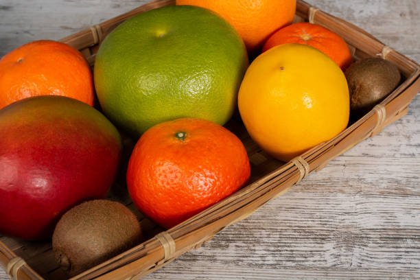 istock Different fruits and citruses in a rattan basket 1130251349
