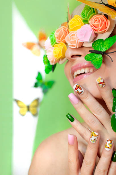 istock Summer nail design with stickers from butterflies 1130253066