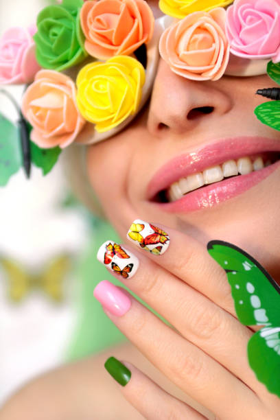 istock Summer nail design with stickers from butterflies 1130253067