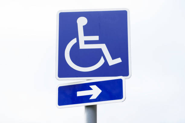 istock Disabled Badge Holders Only at Car Park Sign Post 1130253617