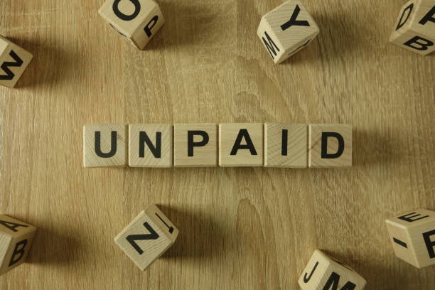 istock Unpaid word from wooden blocks 1130253845