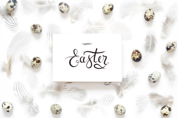 istock Inscription Happy Easter. Pattern with quail eggs and  feathering on white  background. 1130253851