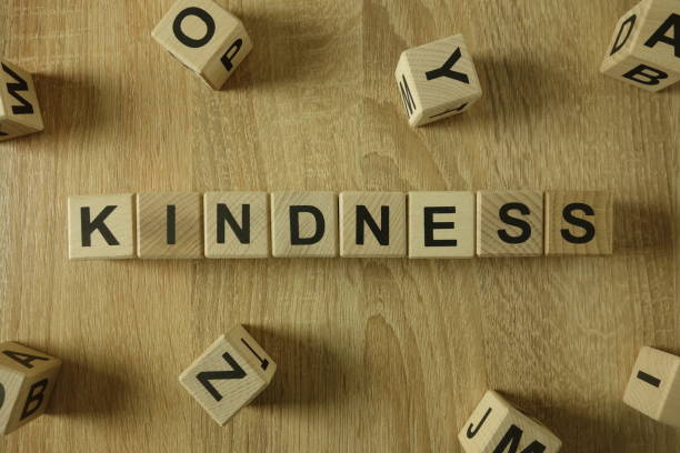 Kindness word from wooden blocks Kindness word from wooden blocks on desk affectionate stock pictures, royalty-free photos & images