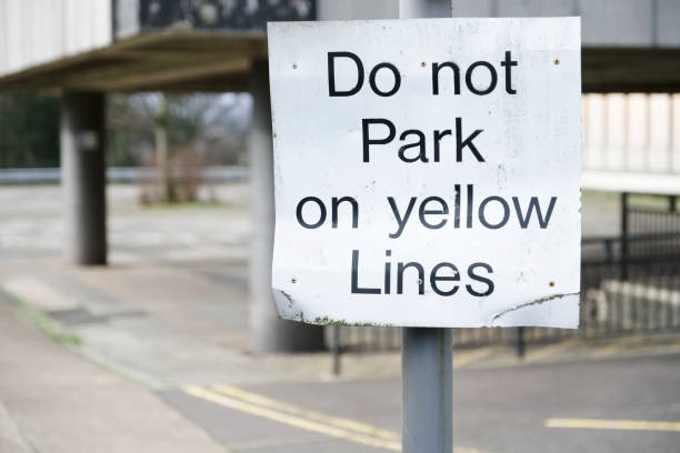 istock Do not park on yellow lines sign 1130254136