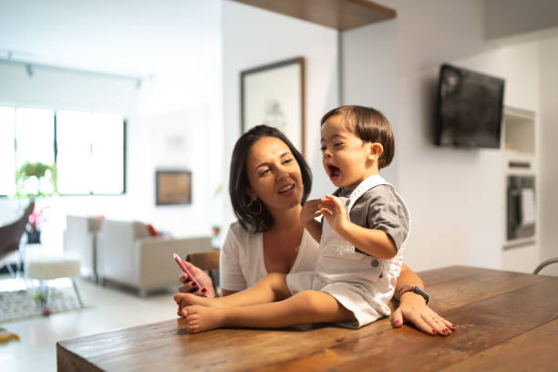 istock Mother and down syndrome son at table 1130255045
