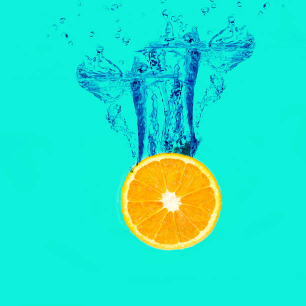istock Fresh Orange with a water splash on background. 1130256420