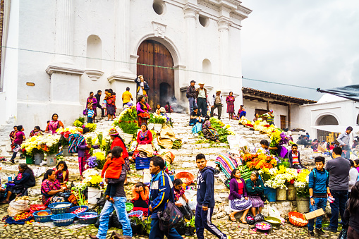 Chichicastenango, Guatemala on 2th May 2016: View on group of indigenous people selling products in front of church