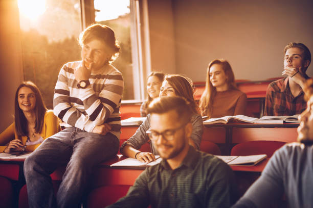 istock Happy college students attending a class in the classroom. 1130258701