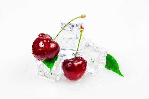 istock Sweet cherries with ice cubes, yes against a white background 1130259123