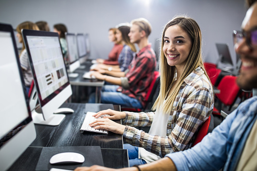 Happy Female Student Using Pc During A Class At Computer Lab Stock ...
