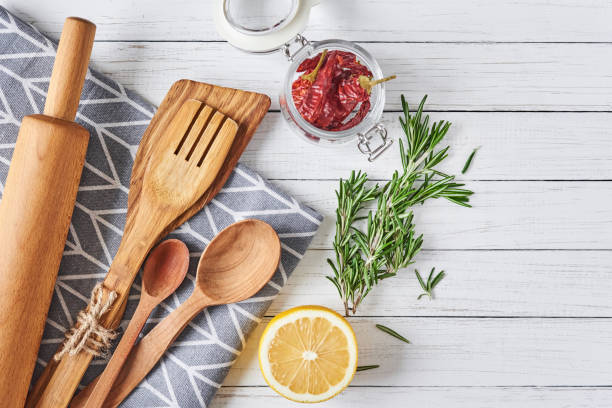 istock Kitchen utensils and cooking ingredients on a white wooden background, top view 1130260239