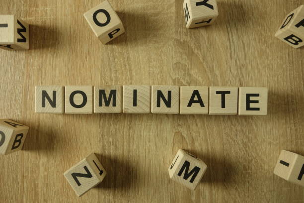 Nominate word from wooden blocks Nominate word from wooden blocks on desk nomination stock pictures, royalty-free photos & images