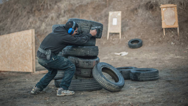 istock Advanced outdoor tactical shooting on target around barrier and wall 1130261727