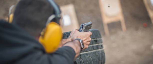 istock Advanced outdoor tactical shooting on target around barrier and wall 1130261895