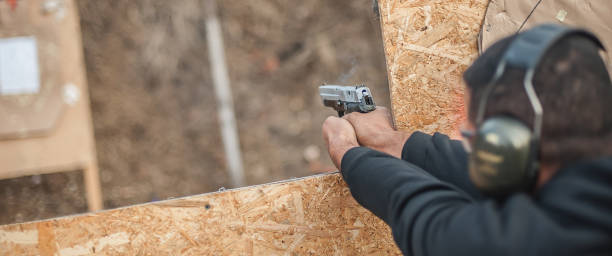 istock Advanced outdoor tactical shooting on target around barrier and wall 1130261943