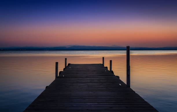 istock Pier at sunset on the lake 1130264491