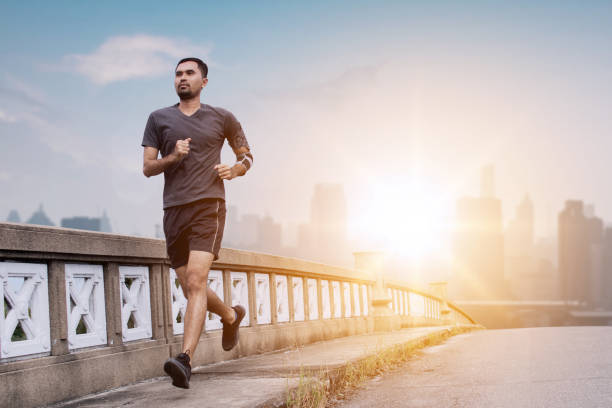 istock man runner running on bridge in city 1130266244