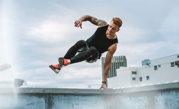 istock Athletic man doing fitness training on rooftop 1130267043