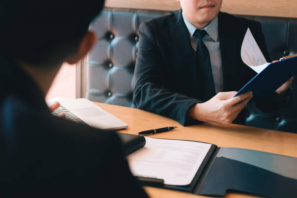 istock Confident caucasian manager interviews talking with a client prospective male employee. 1130270009